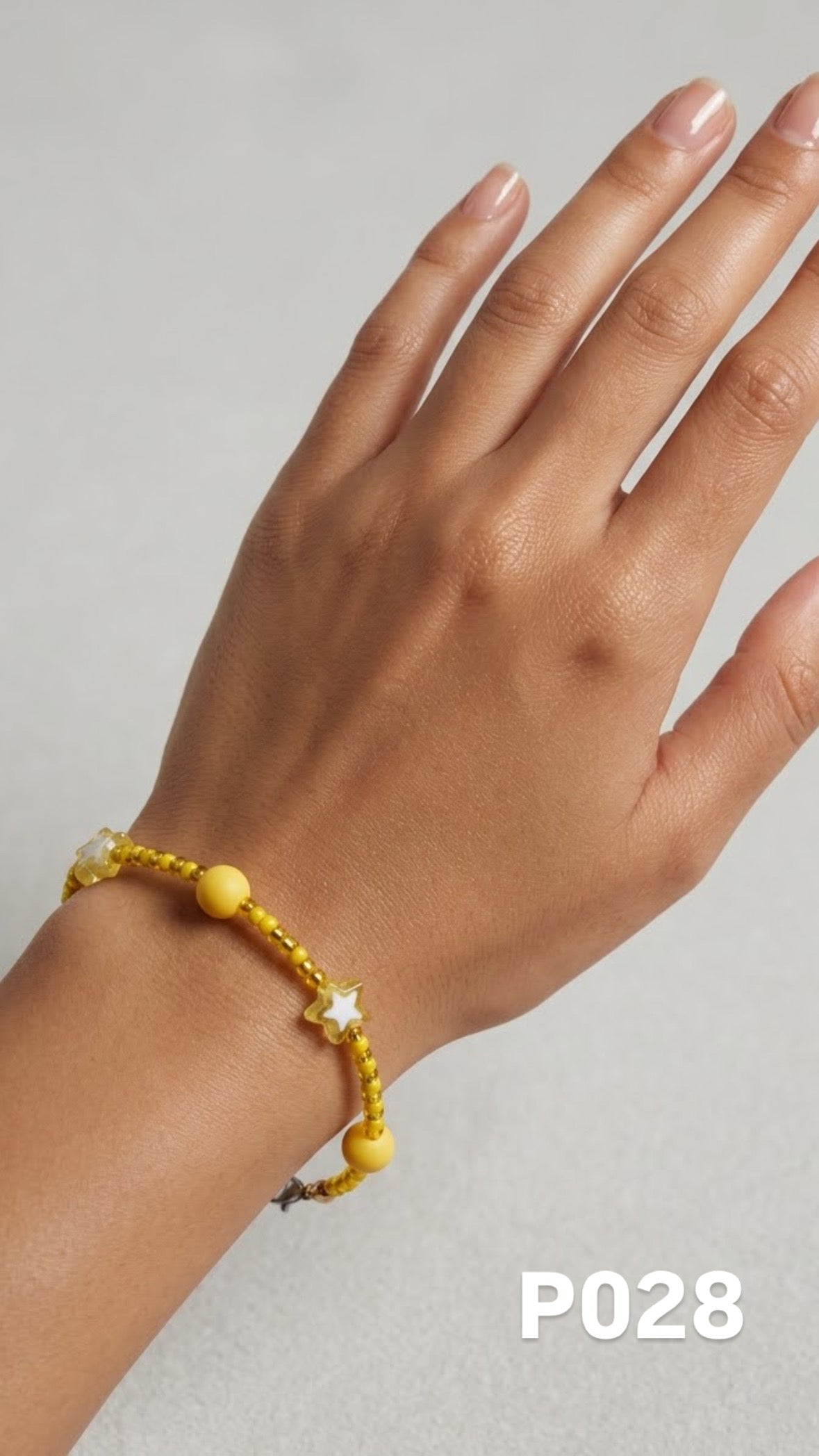 Pulsera estrellas y pelotitas amarillas