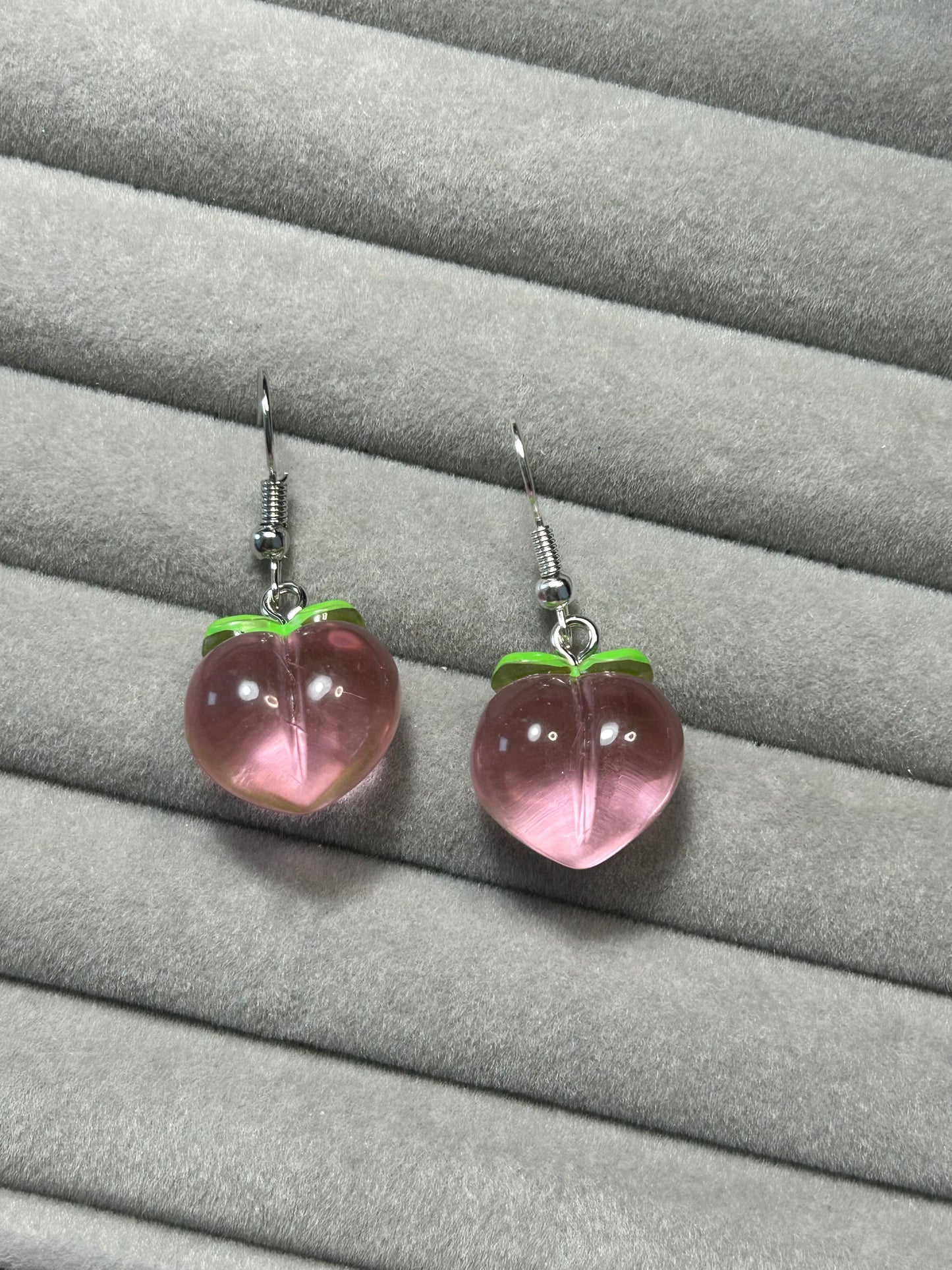 Aretes melocotones