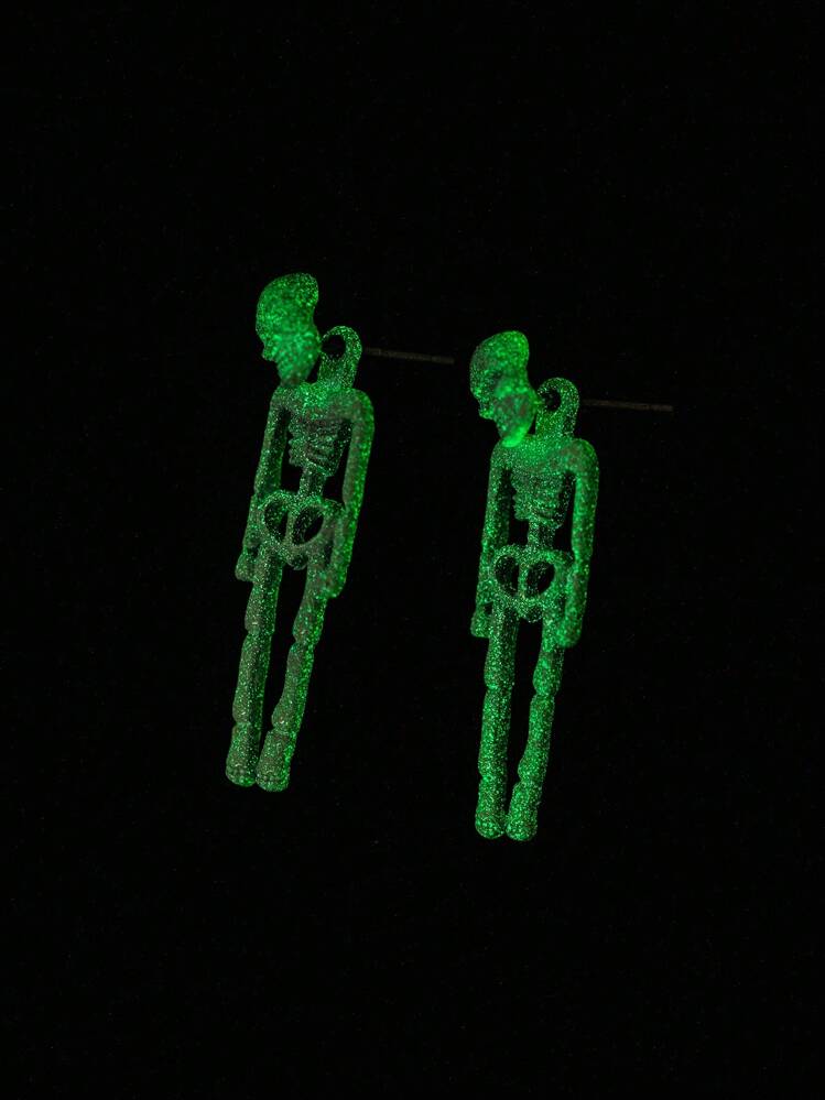 Aretes esqueletos fluorescentes blanco