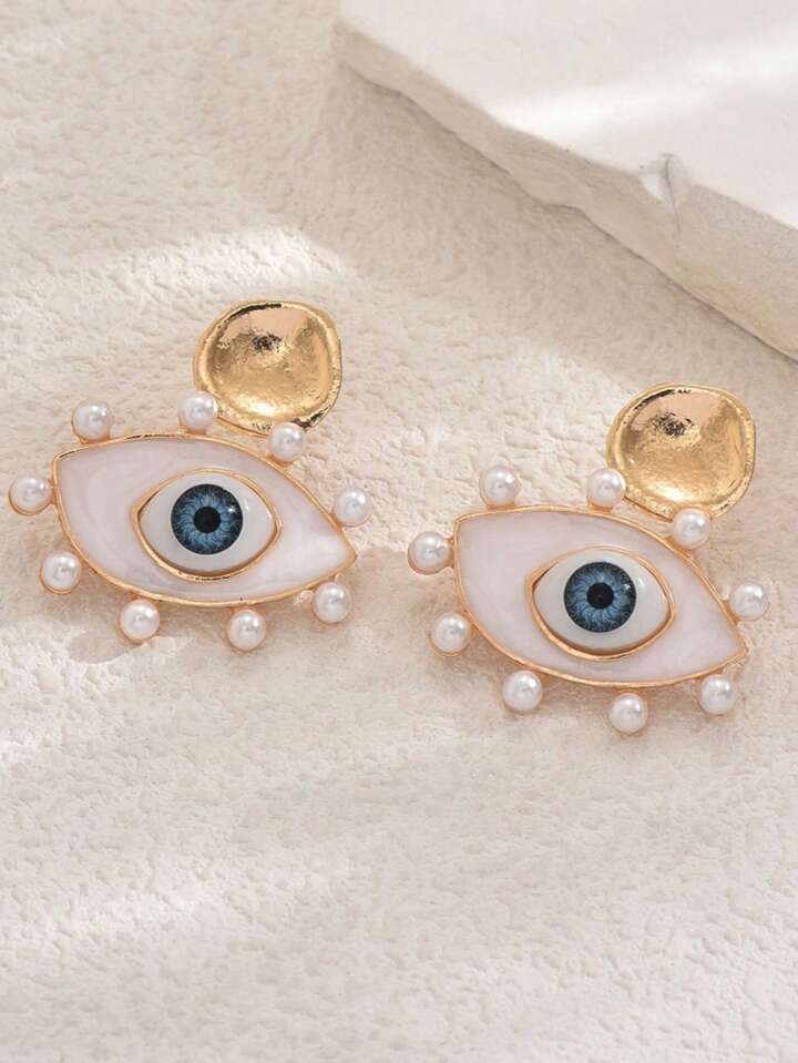 Aretes ojos perlas