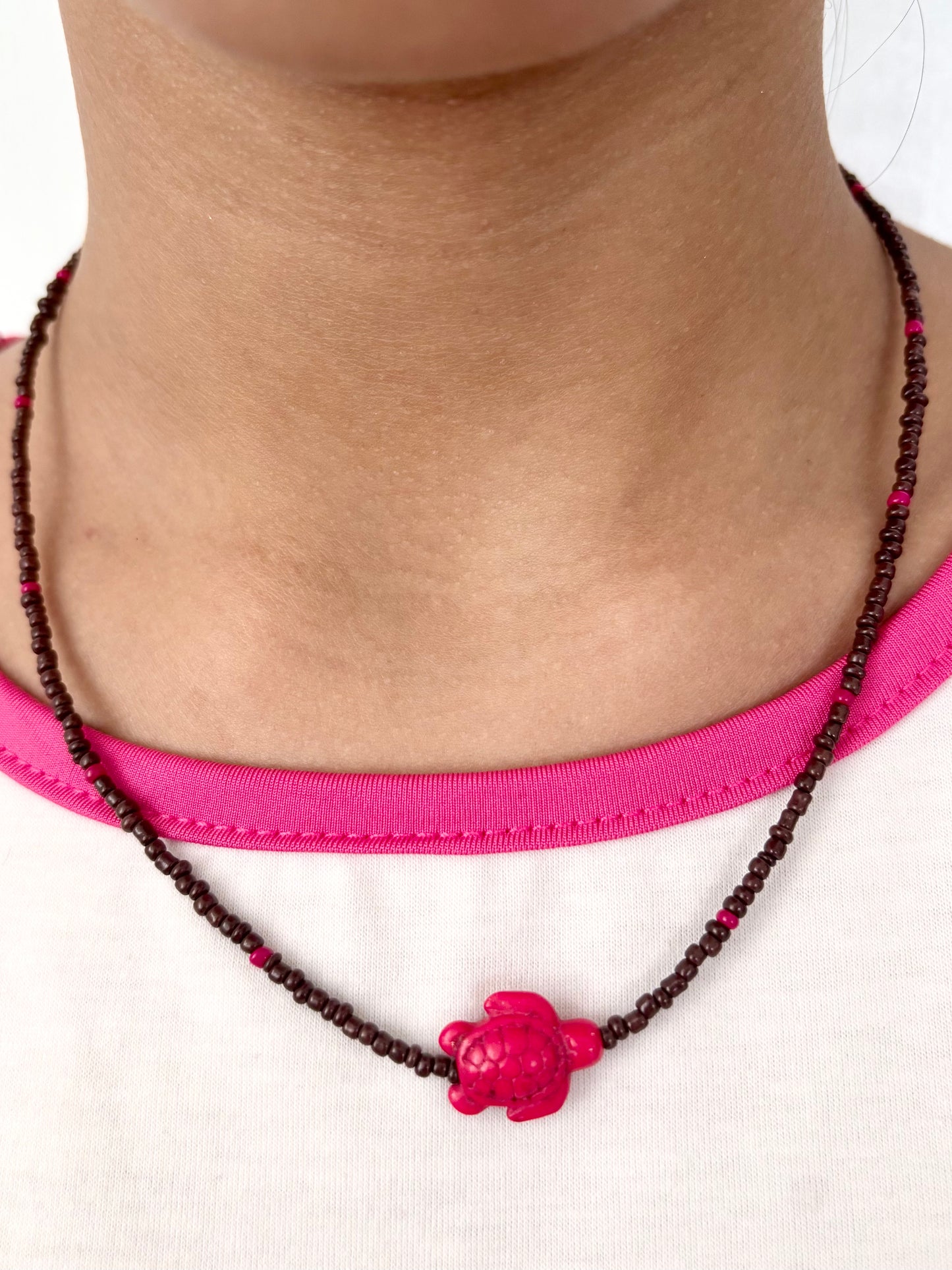 Collar tortuga fucsia