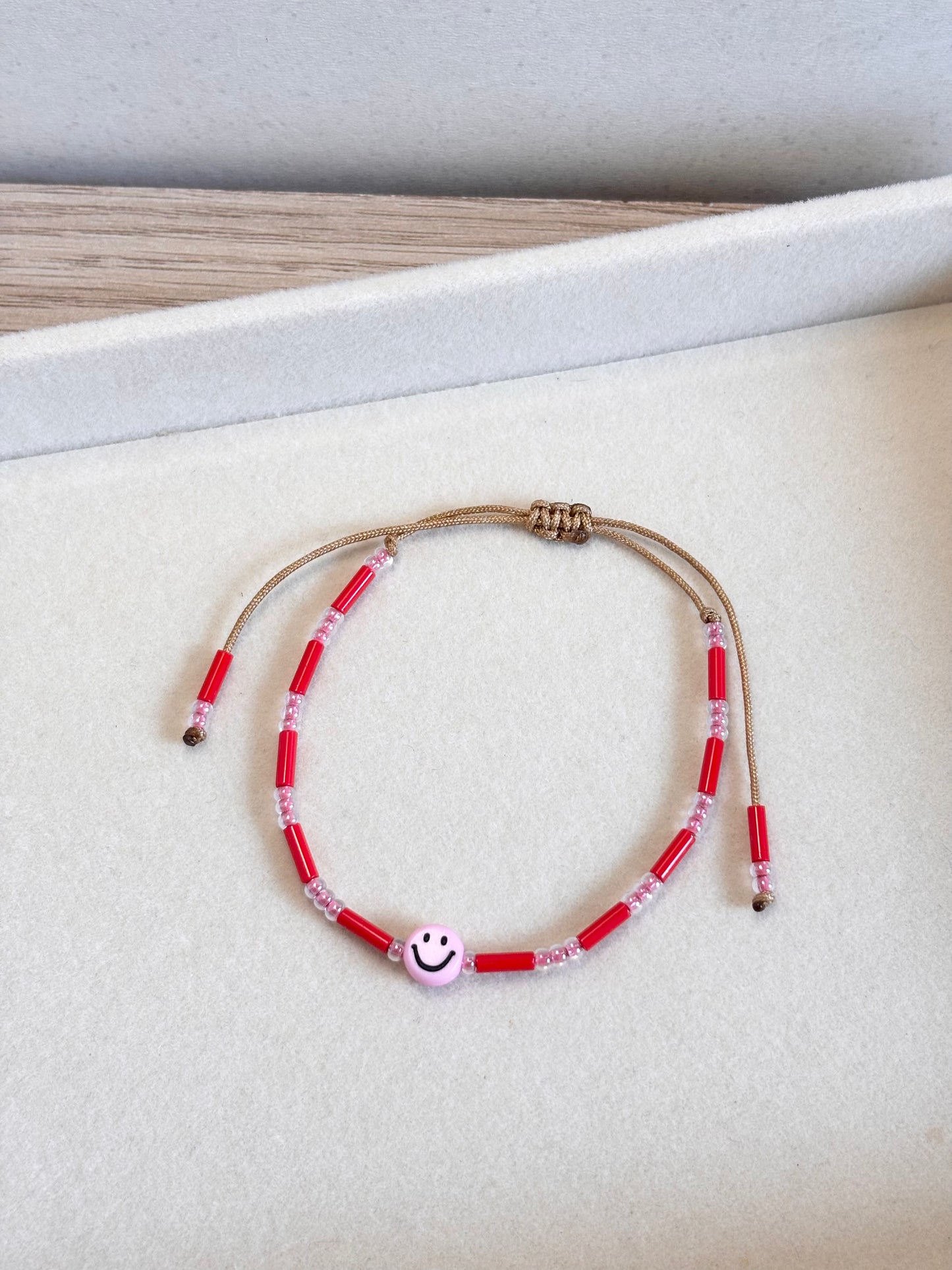 Pulsera carita rosa