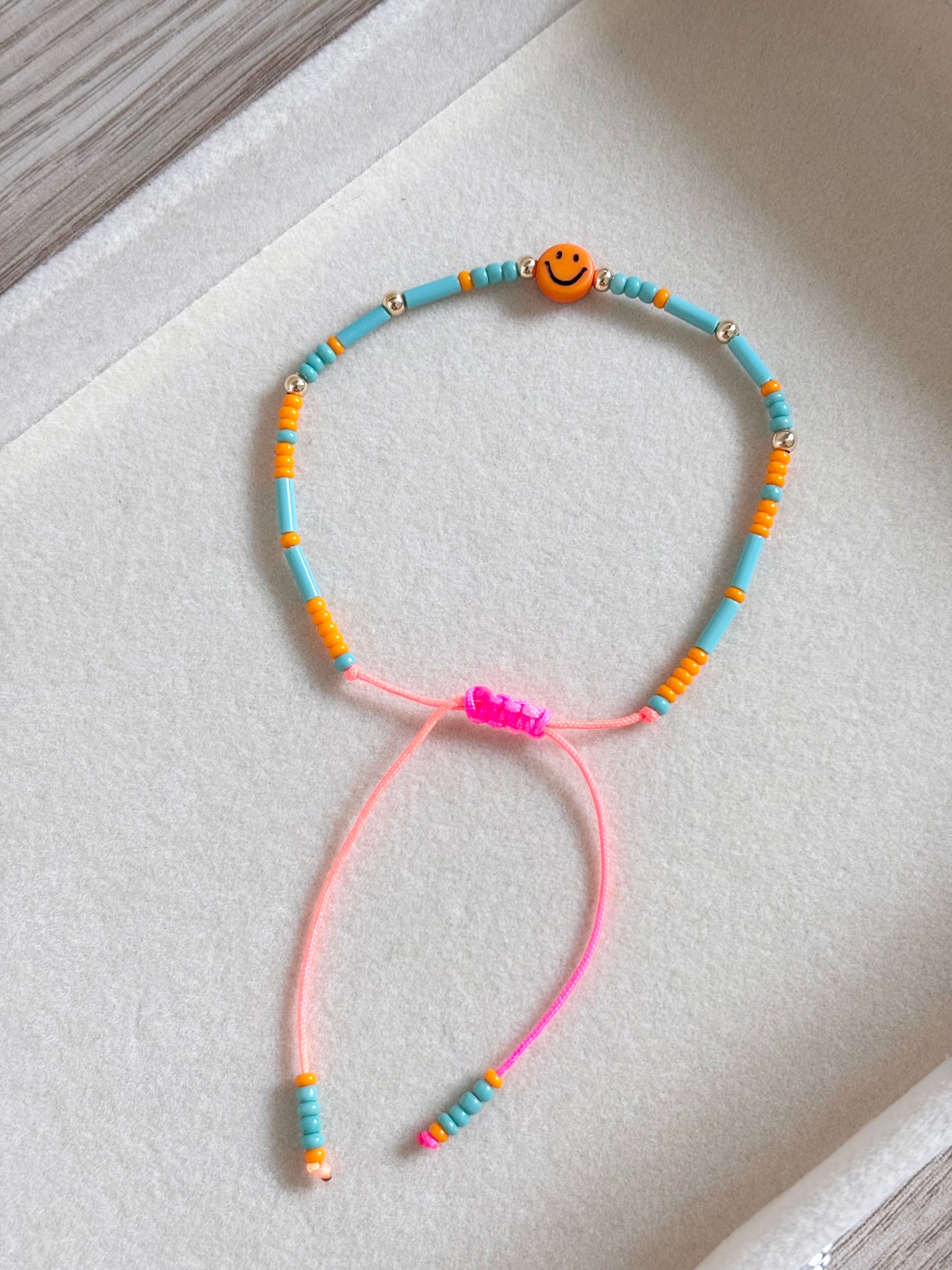Pulsera carita feliz naranja
