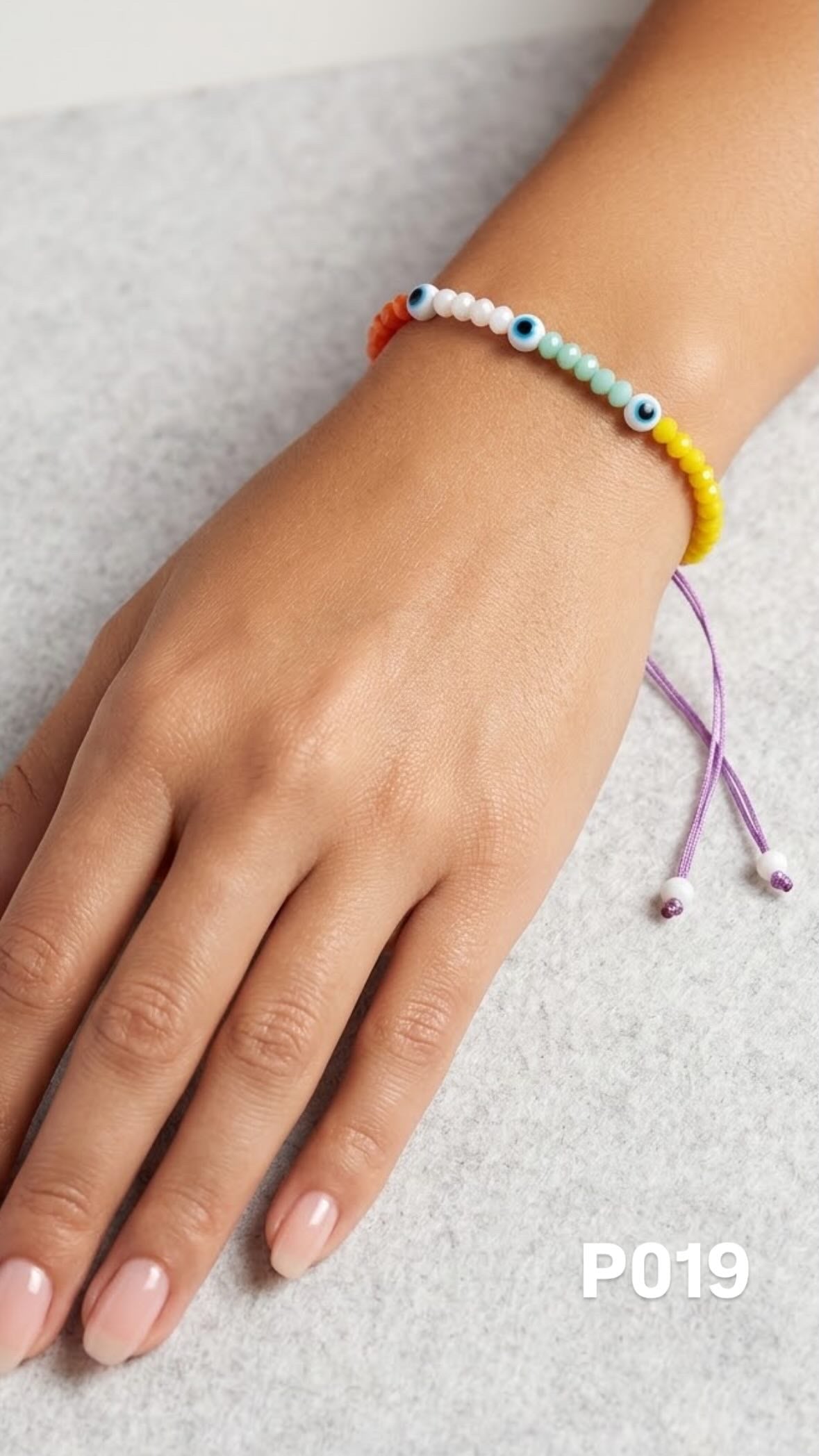 Pulsera ojitos colores