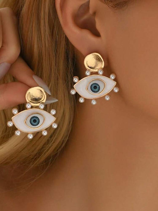Aretes ojos perlas