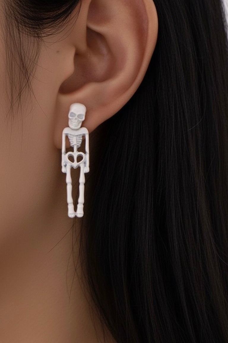 Aretes esqueleto blanco fluorescente