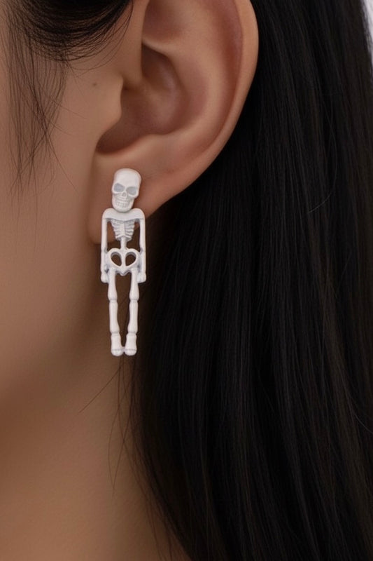 Aretes esqueleto blanco fluorescente