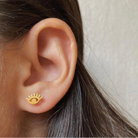 Aretes ojos dorado